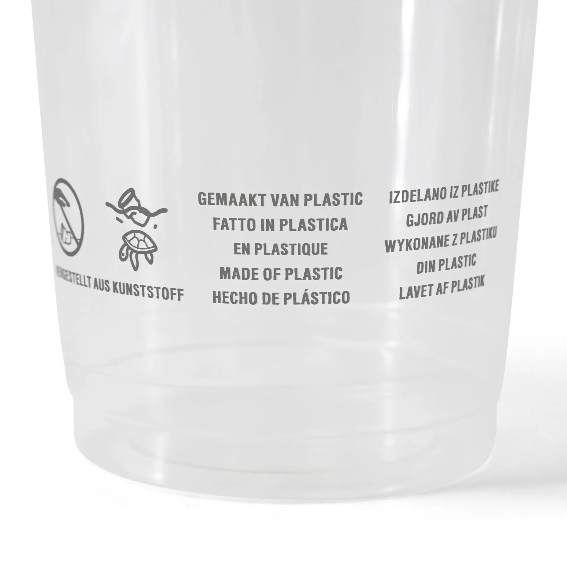 Heldere plastic beker met bedrukte meertalige tekst en symbolen, die materiaal- en gebruiksinstructies aangeven.