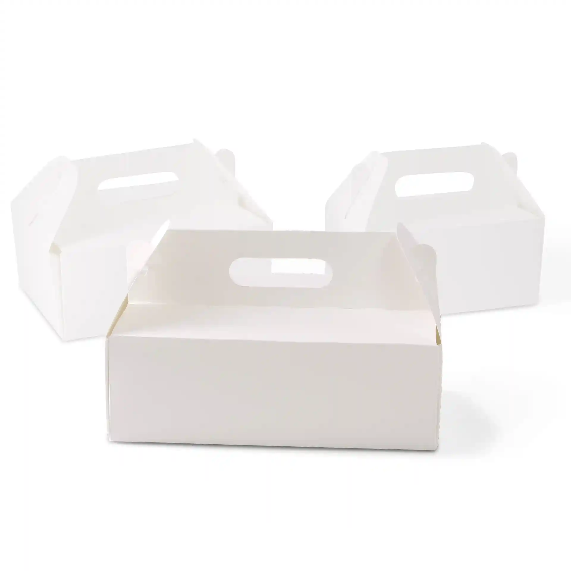 Drie witte kartonnen taartdozen met handvatten, rechthoekig en opvouwbaar.