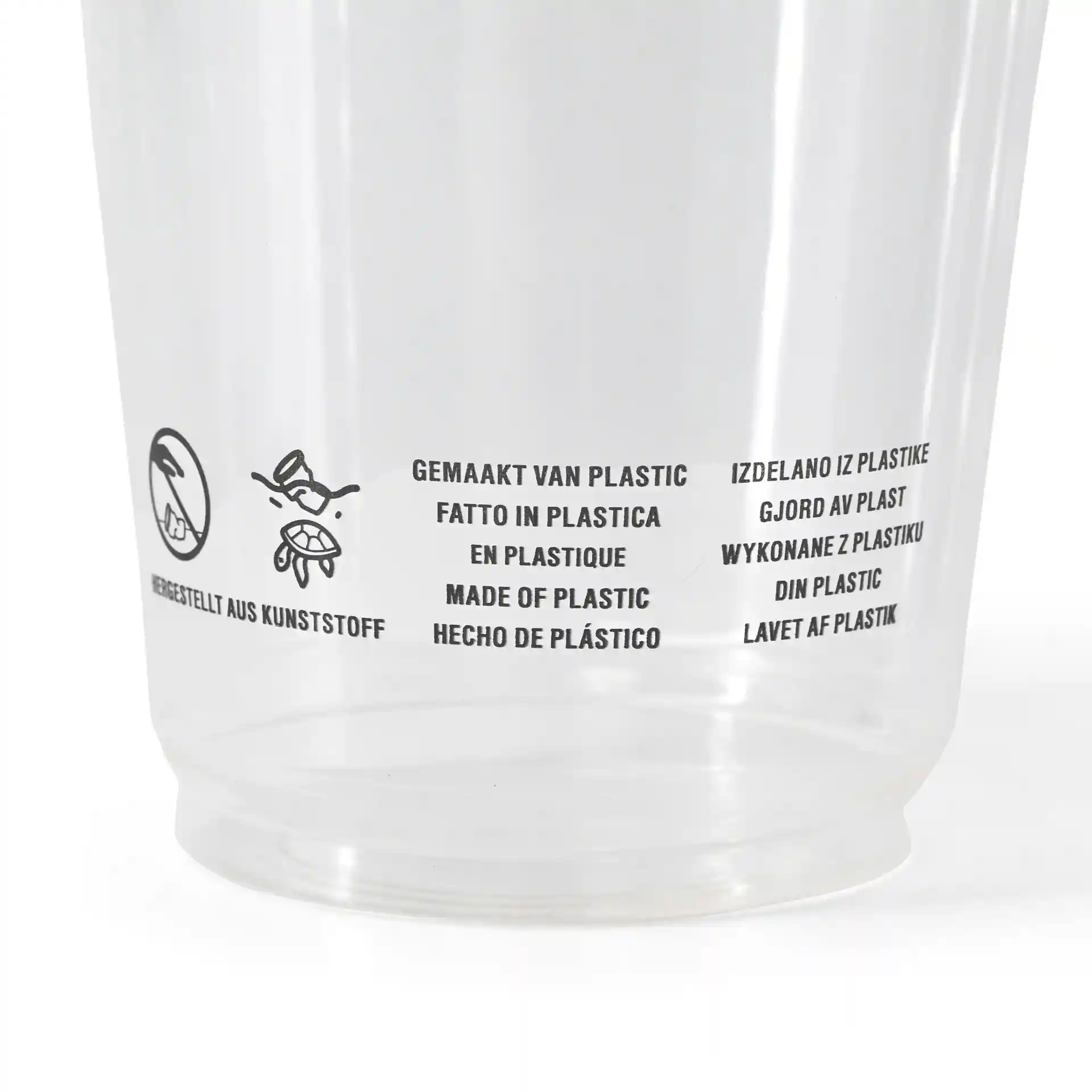 Heldere plastic beker met bedrukte meertalige tekst over materiaal en gebruiksaanwijzingen.