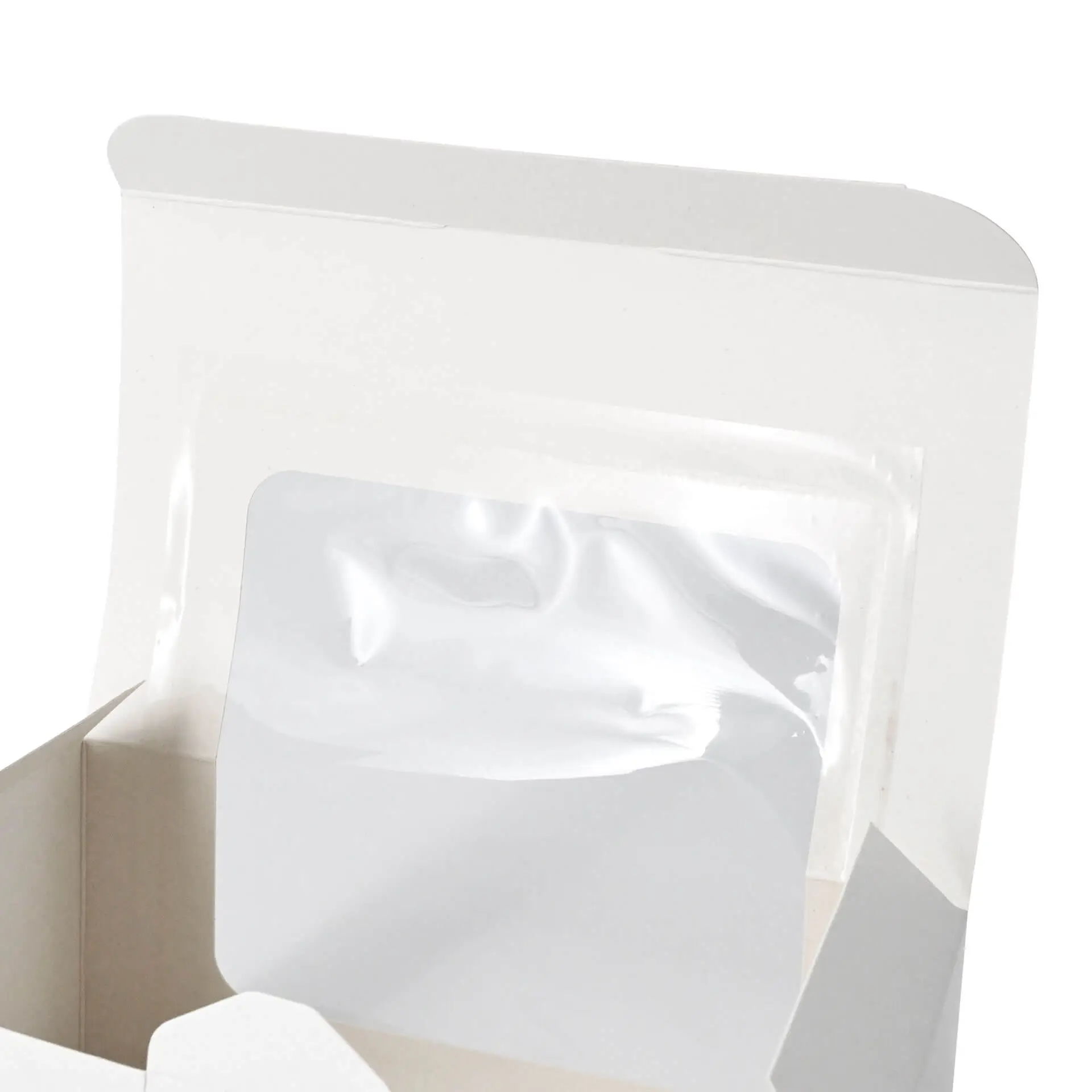 Witte cupcake-doos met een cellulosevenster en twee compartimenten voor gebak binnenin.