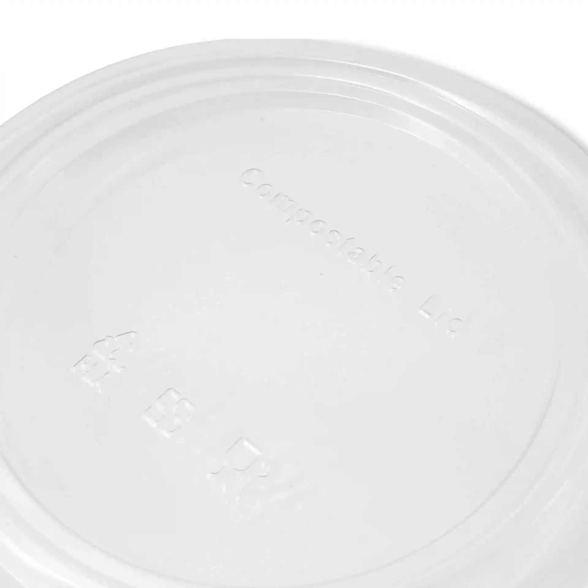 Transparante ronde bekerdeksel van PLA, met reliëfmarkeringen op het oppervlak.