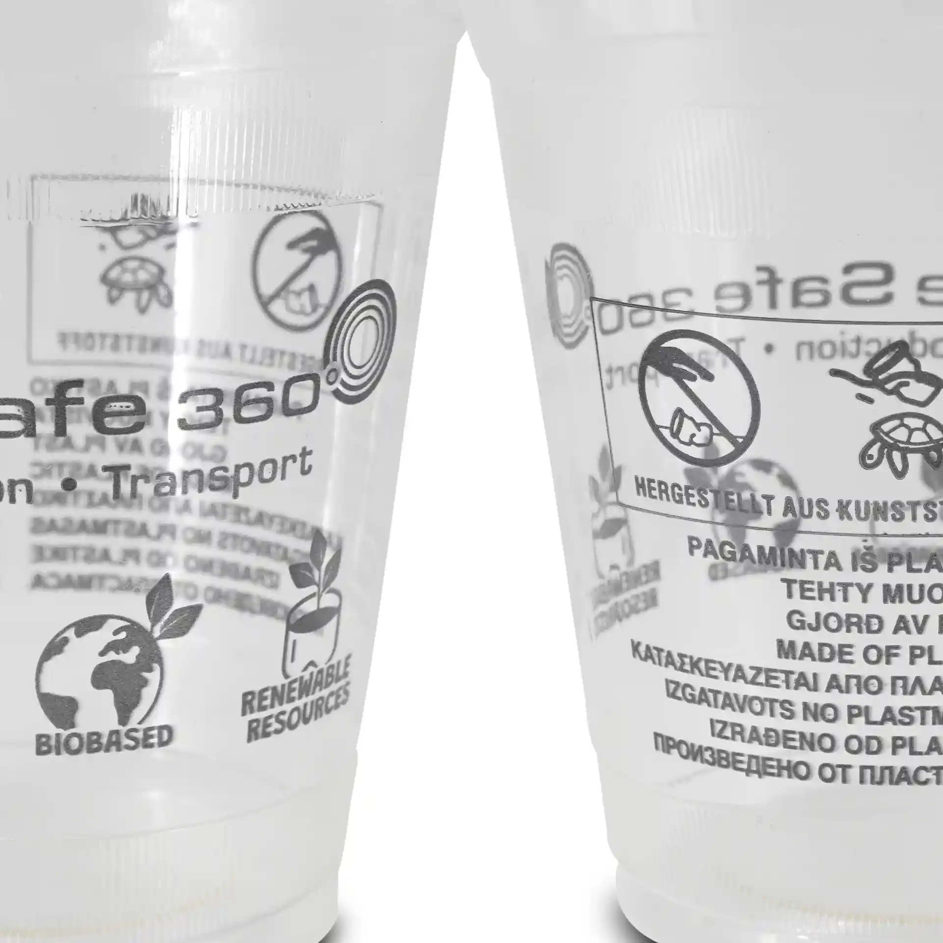 Transparante 12 oz PLA smoothie bekers met gedrukte symbolen en labels, met verschillende markeringen en ontwerpen.
